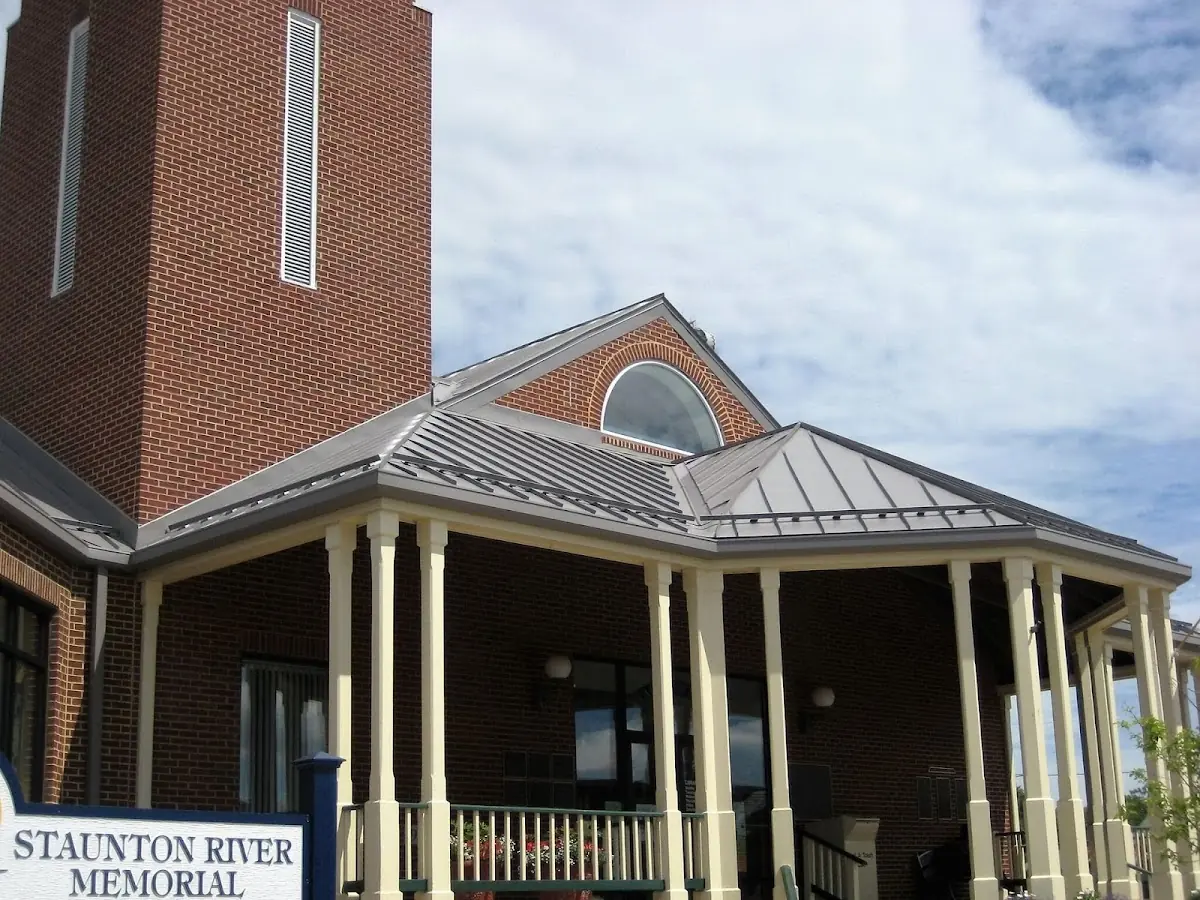 Skilled roofing craftsmen working on a residential roof in Van Hornesville